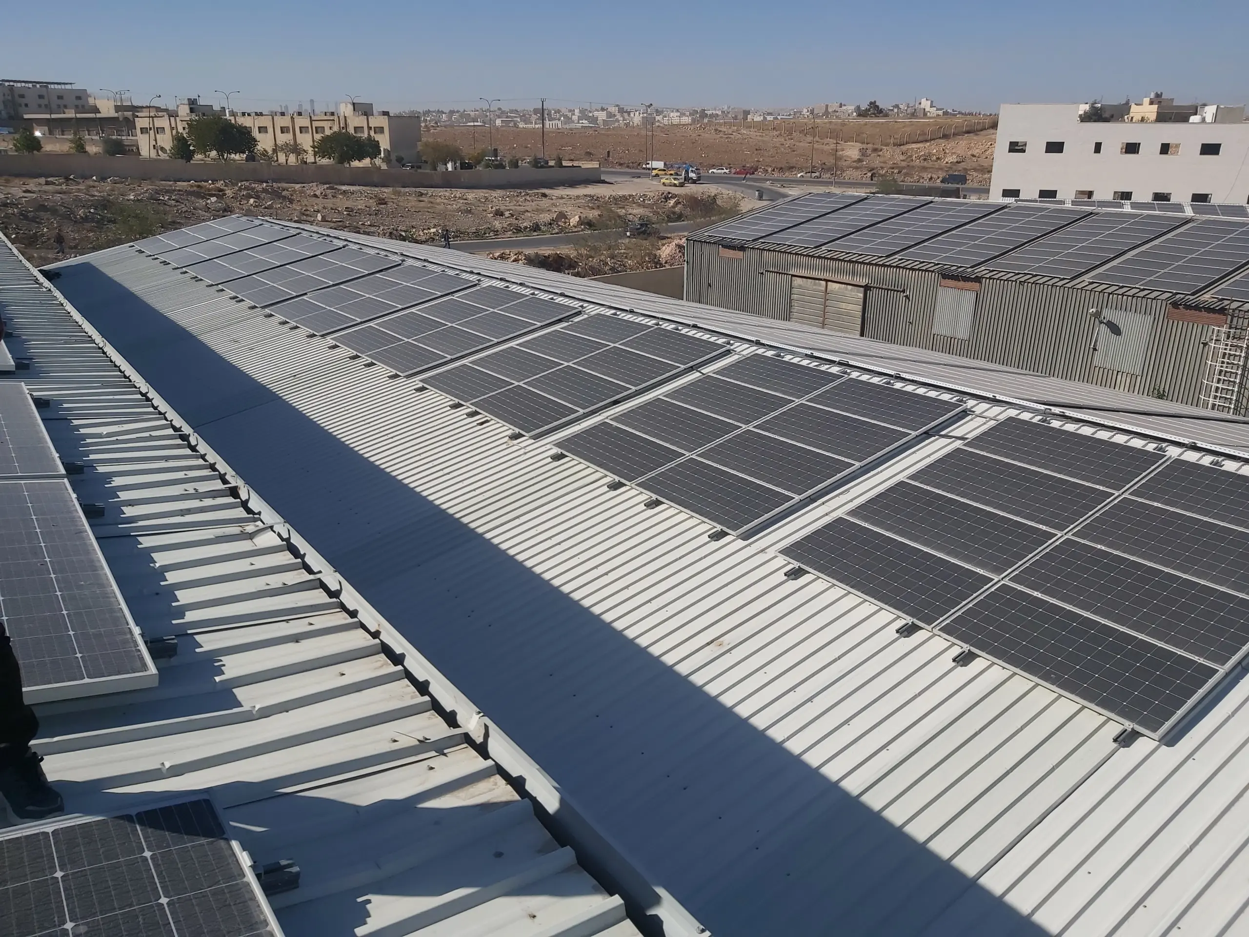 Roof-mounted solar PV arrays on University of Jordan buildings